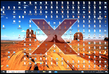 Exemple d'un espace de travail encombré : Un bureau d'ordinateur couvert d’icônes où se mélange dossiers, de fichiers et de raccourcis dans tous les sens